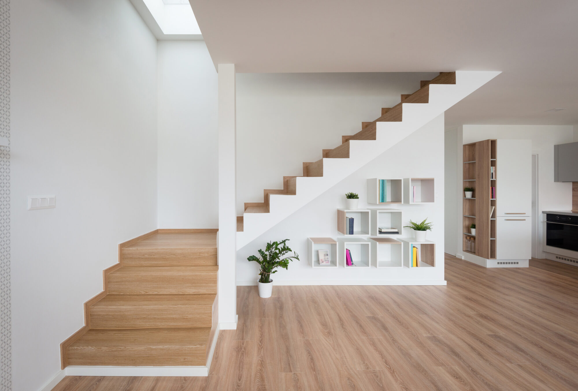 interior of contemporary living room with wooden stairway