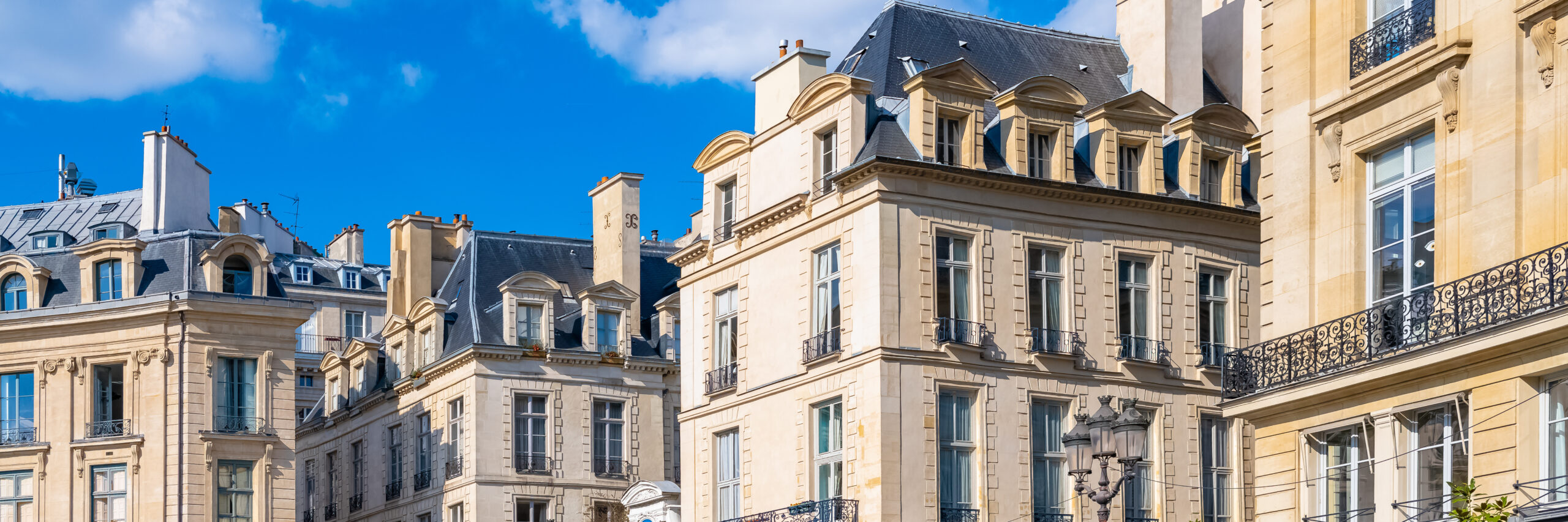paris, beautiful buildings place des victoires, typical parisian facades and windows